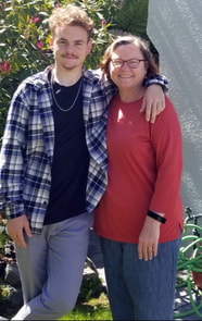Smiling mother with happy teenage son