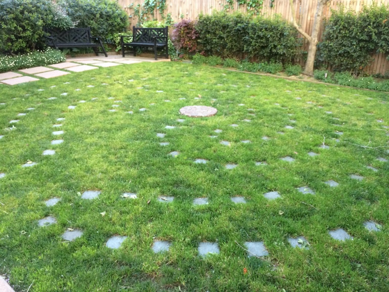 Grass with paving in a labyrinth pattern